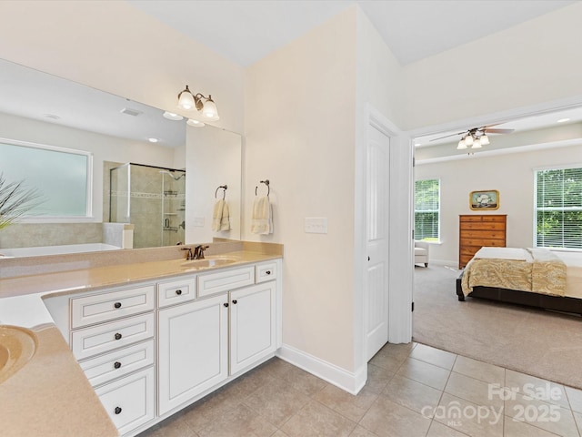 bathroom featuring baseboards, a shower stall, tile patterned flooring, connected bathroom, and vanity