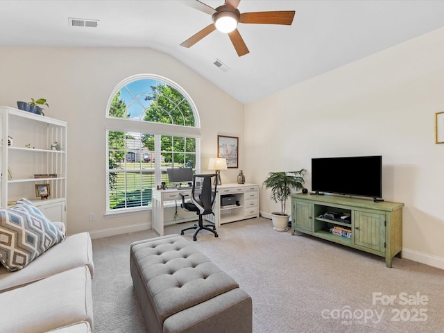 office featuring baseboards, ceiling fan, visible vents, and light colored carpet