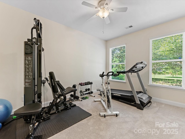 workout room featuring ceiling fan, baseboards, and visible vents