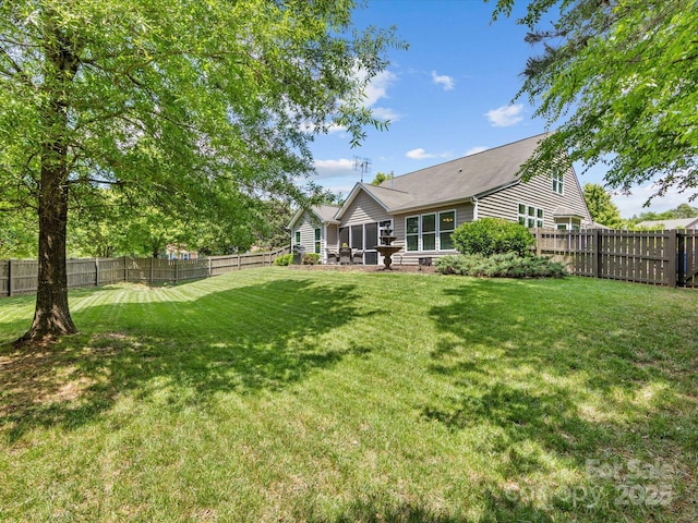 view of yard with a fenced backyard