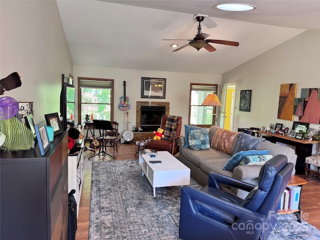 5A Hedgerose Ct, Asheville, NC 28805 - living area featuring a ceiling fan, vaulted ceiling, wood finished floors, and a fireplace