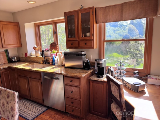5A Hedgerose Ct, Asheville, NC 28805 - kitchen featuring glass insert cabinets, brown cabinets, light stone counters, a sink, and dishwasher