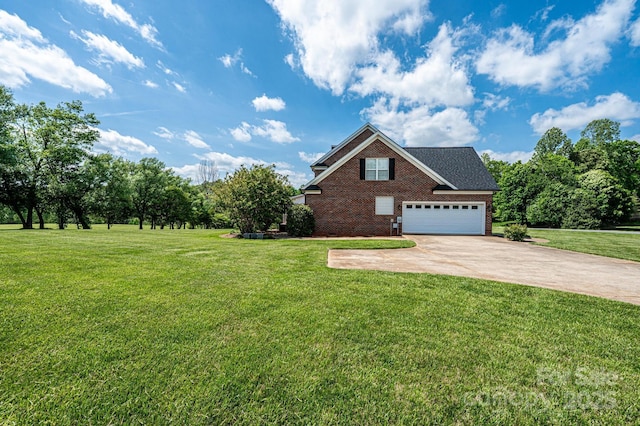 view of front of house with brick siding, driveway, and a front yard