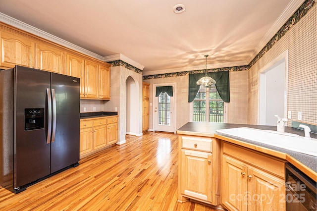 kitchen featuring crown molding, stainless steel fridge, arched walkways, light wood-style flooring, and dishwasher