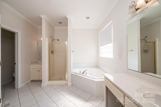 bathroom with vanity, toilet, tile patterned floors, a shower stall, and a garden tub