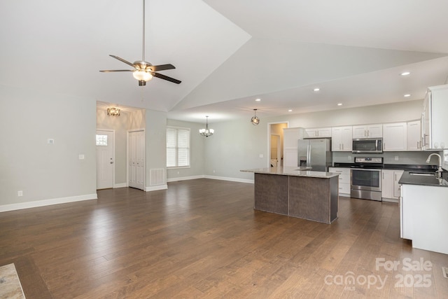 76 Tryon View Dr, Flat Rock, NC 28731 - kitchen featuring high vaulted ceiling, ceiling fan with notable chandelier, stainless steel appliances, open floor plan, and recessed lighting