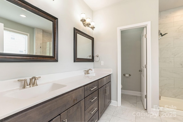 76 Tryon View Dr, Flat Rock, NC 28731 - full bathroom featuring baseboards, a sink, marble finish floor, and a stall shower