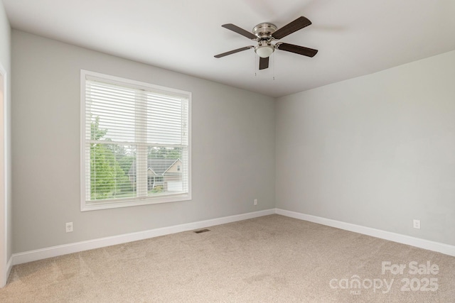76 Tryon View Dr, Flat Rock, NC 28731 - spare room featuring light colored carpet, a ceiling fan, baseboards, and visible vents