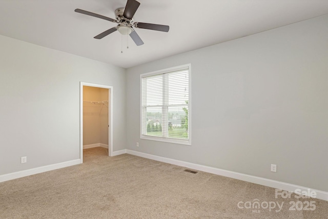76 Tryon View Dr, Flat Rock, NC 28731 - empty room with baseboards, visible vents, a ceiling fan, and light colored carpet