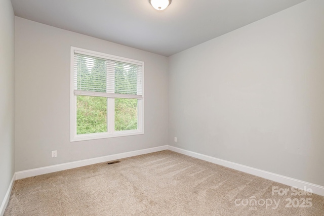 76 Tryon View Dr, Flat Rock, NC 28731 - carpeted empty room featuring baseboards and visible vents