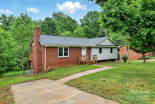 131 Little Forest Ln, Statesville, NC 28625 - ranch-style house with a chimney, a front yard, roof with shingles, central air condition unit, and brick siding