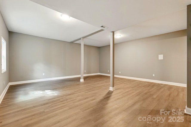 131 Little Forest Ln, Statesville, NC 28625 - below grade area with baseboards, light wood-type flooring, and visible vents