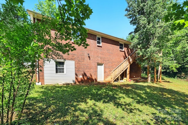 131 Little Forest Ln, Statesville, NC 28625 - rear view of property featuring a yard and brick siding