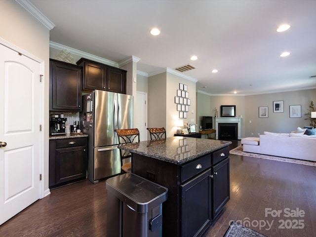 4012 Martele Dr, Mint Hill, NC 28227 - kitchen with freestanding refrigerator, ornamental molding, visible vents, recessed lighting, and dark wood-style floors
