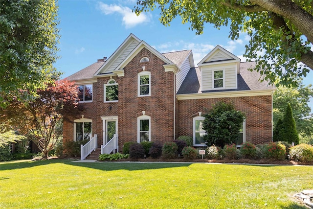 7700 Ninth Fairway Ln, Mint Hill, NC 28227 - colonial home with a shingled roof, a chimney, a front lawn, and brick siding