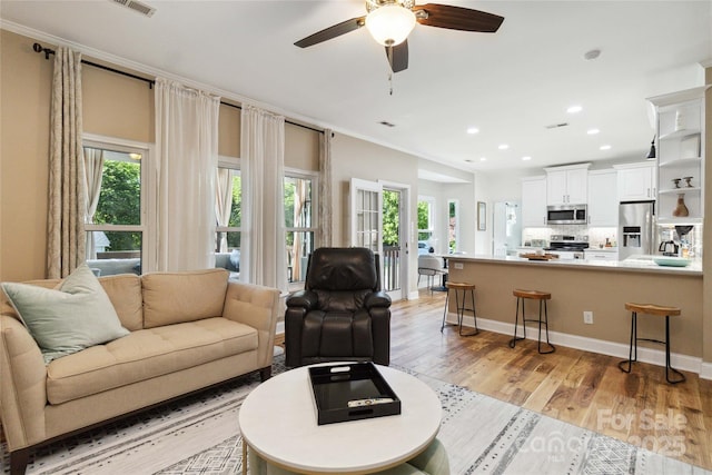 7700 Ninth Fairway Ln, Mint Hill, NC 28227 - living room with plenty of natural light, recessed lighting, light wood-style flooring, and a ceiling fan