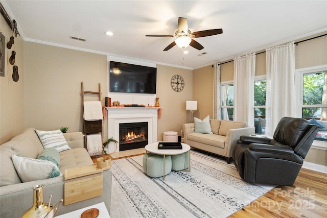 7700 Ninth Fairway Ln, Mint Hill, NC 28227 - living area featuring visible vents, ornamental molding, ceiling fan, and wood finished floors