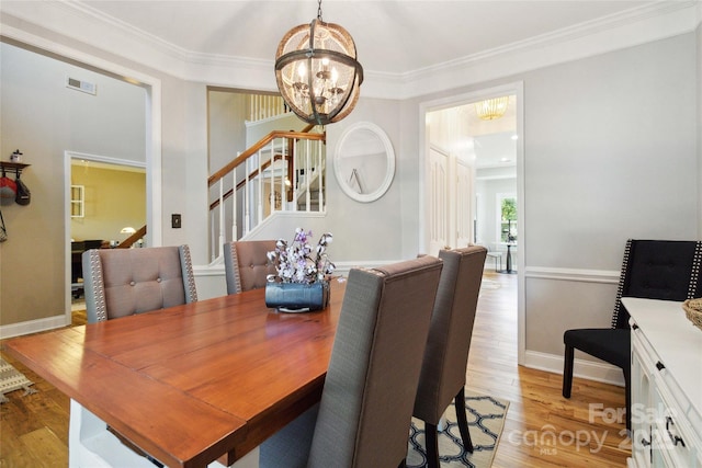 7700 Ninth Fairway Ln, Mint Hill, NC 28227 - dining room featuring stairway, visible vents, wood finished floors, and a chandelier