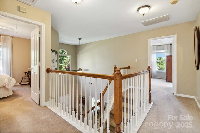 7700 Ninth Fairway Ln, Mint Hill, NC 28227 - hallway featuring carpet floors, attic access, an upstairs landing, and visible vents