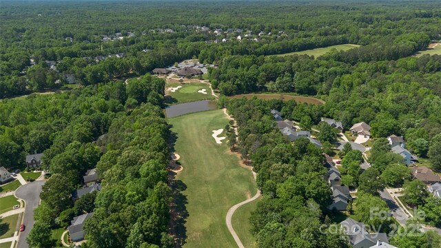 7700 Ninth Fairway Ln, Mint Hill, NC 28227 - birds eye view of property featuring golf course view, a residential view, and a forest view