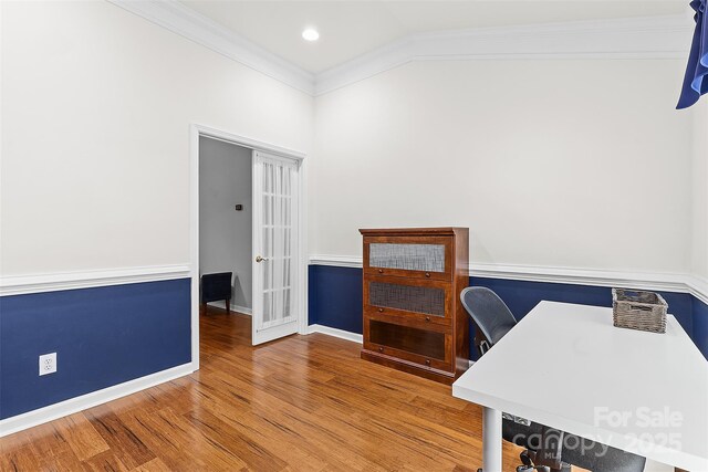 home office featuring baseboards, ornamental molding, wood finished floors, and lofted ceiling