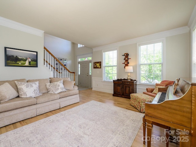 10944 Persimmon Creek Dr, Mint Hill, NC 28227 - living room with crown molding, light wood-style flooring, stairs, and wainscoting