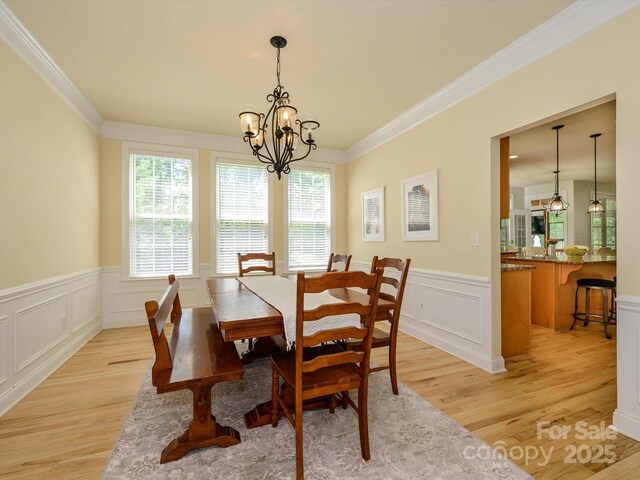 10944 Persimmon Creek Dr, Mint Hill, NC 28227 - dining area with a decorative wall, an inviting chandelier, and light wood-type flooring