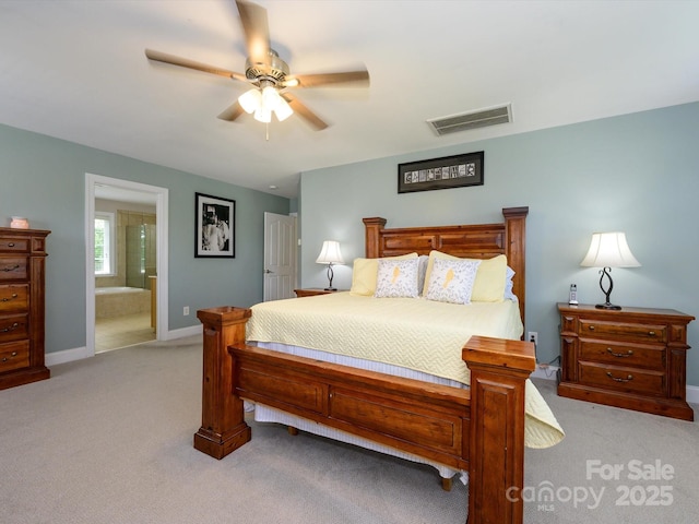 10944 Persimmon Creek Dr, Mint Hill, NC 28227 - bedroom featuring ceiling fan, light colored carpet, visible vents, baseboards, and ensuite bath
