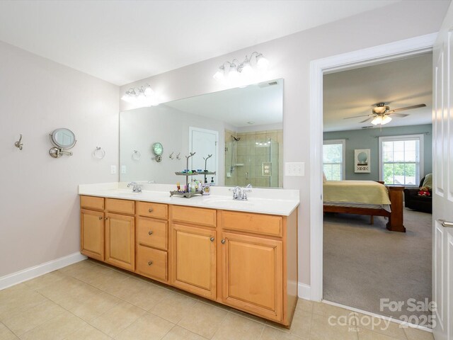10944 Persimmon Creek Dr, Mint Hill, NC 28227 - ensuite bathroom featuring double vanity, ceiling fan, visible vents, a shower stall, and connected bathroom