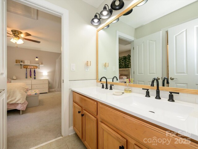 10944 Persimmon Creek Dr, Mint Hill, NC 28227 - ensuite bathroom featuring tile patterned flooring, a sink, connected bathroom, and ceiling fan