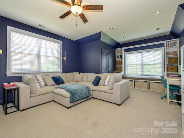 10944 Persimmon Creek Dr, Mint Hill, NC 28227 - living area with a ceiling fan, vaulted ceiling, carpet flooring, and visible vents