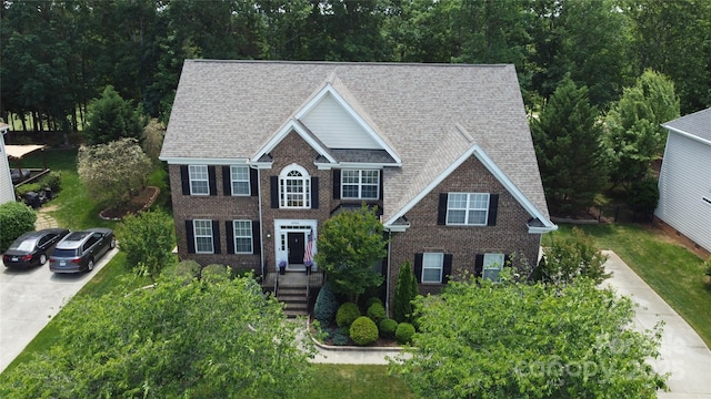 10944 Persimmon Creek Dr, Mint Hill, NC 28227 - colonial house with brick siding, a shingled roof, and driveway