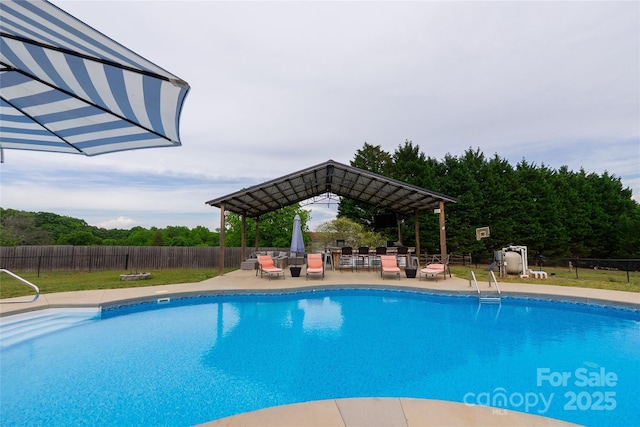 view of pool featuring fence and a patio