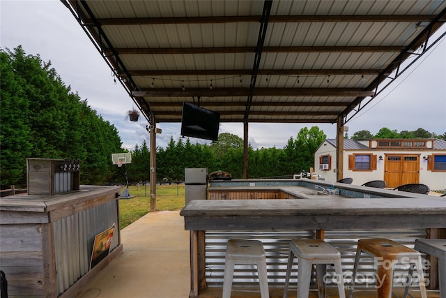 view of patio / terrace featuring a pool and an outdoor structure