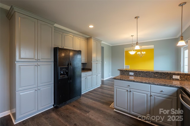 kitchen with black fridge, dark wood finished floors, crown molding, stainless steel dishwasher, and baseboards