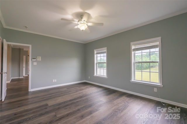 spare room with a ceiling fan, crown molding, baseboards, and dark wood-style floors