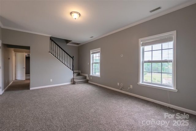 unfurnished living room with crown molding, baseboards, stairway, and carpet