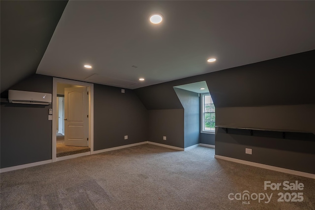 additional living space with a wall unit AC, carpet flooring, baseboards, lofted ceiling, and recessed lighting