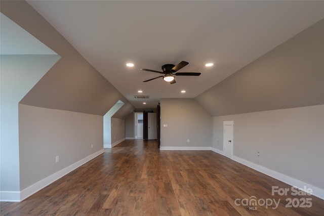 bonus room featuring a ceiling fan, lofted ceiling, baseboards, dark wood-type flooring, and recessed lighting