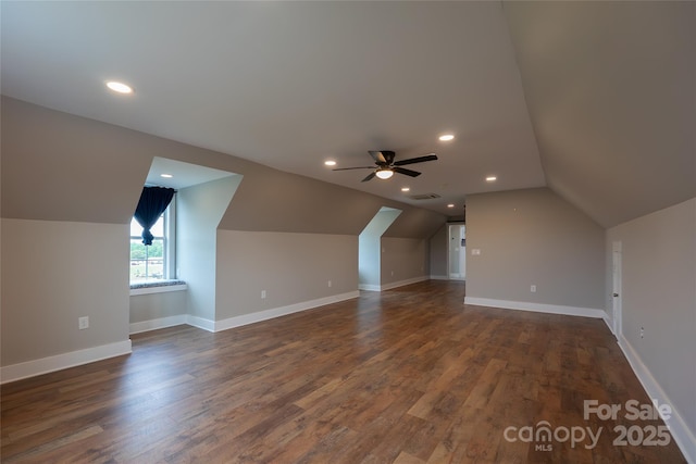 additional living space with lofted ceiling, ceiling fan, dark wood-style flooring, baseboards, and recessed lighting