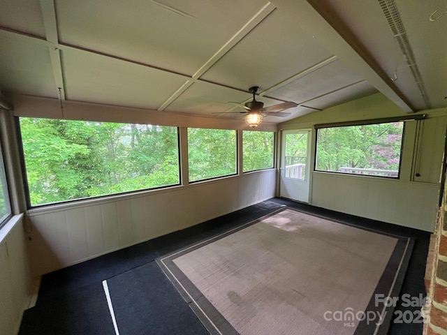 unfurnished sunroom with ceiling fan