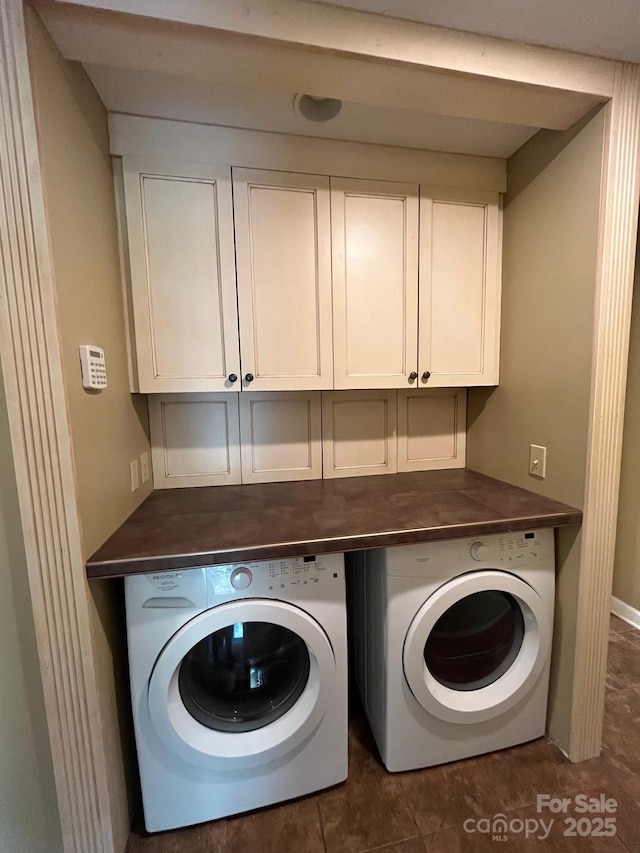 laundry area featuring washer and dryer and cabinet space