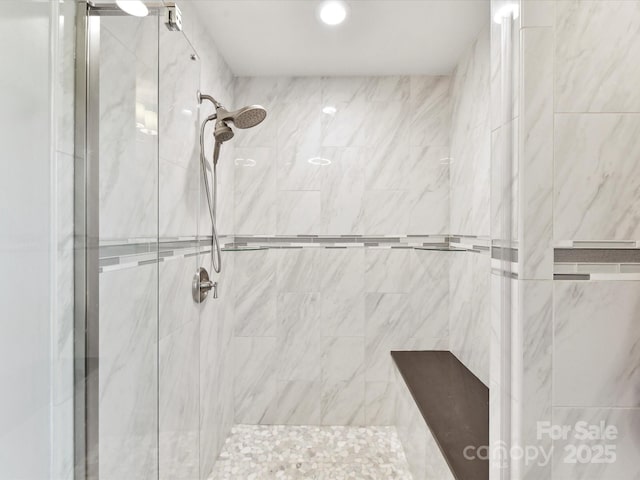bathroom featuring recessed lighting and a stall shower