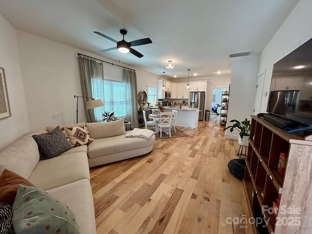 24 Wheeler Rd, Weaverville, NC 28787 - living room with light wood-style flooring and a ceiling fan