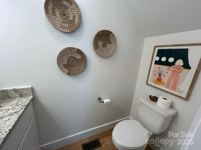 24 Wheeler Rd, Weaverville, NC 28787 - half bathroom featuring baseboards, toilet, vanity, and wood finished floors