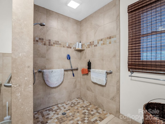 bathroom with tiled shower