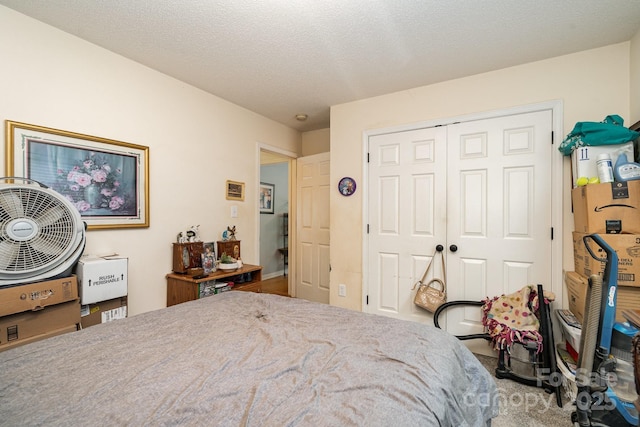 bedroom with carpet floors and a closet