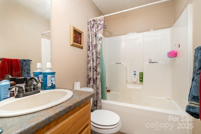 bathroom with vanity, toilet, a textured ceiling, and shower / tub combo