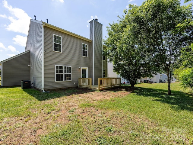 521 Ellingsworth Ln, Charlotte, NC 28214 - rear view of property with a chimney, a wooden deck, a yard, and cooling unit