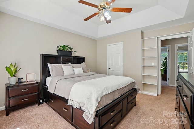 2379 Whitley Rd, Fort Mill, SC 29708 - bedroom with light carpet, a tray ceiling, a ceiling fan, and baseboards